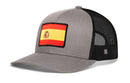 Haka Hat Spain Flag International Trucker Hat grey snapback cap with a black mesh back and a square patch featuring the flag of Spain on the front.