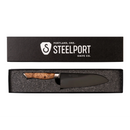 Introducing the Steelport Knife Co. 6" Chef Knife, an American-made piece expertly handcrafted by Steelport Knife Co. This chef knife features a beautiful wooden handle and comes presented in a black box with “Steelport Knife Co.” and “Portland, Ore.” elegantly printed on the lid. Nestled securely in a foam insert, it highlights exceptional craftsmanship and sophisticated design.