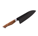 The Steelport Knife Co. 6" Chef Knife is a handcrafted carbon steel chef knife featuring a dark blade and a polished wooden handle, displayed against a white background.