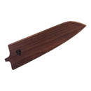 The Steelport Knife Co. 8" Sheath is crafted from Oregon Maple and finished in a rich brown hue. It features a carved S logo on the left side and is shaped with a pointed tip to perfectly fit a chef’s knife, reflecting the quality craftsmanship of American-made knives.