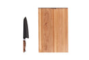The Steelport Knife Co. Everyday Knife & Board Set by Steelport Knife Co., featuring a chef knife with a wooden handle, is displayed vertically beside a large rectangular SteelCore cutting board against a white background.