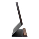 A side view of a thin, modern computer monitor with a wooden stand and a sleek, minimalist design that evokes the elegance of the Steelport Knife Co. Knife Block by Steelport Knife Co., reminiscent of premium kitchen knife storage.