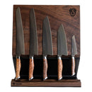The Steelport Knife Co. Knife Block, by Steelport Knife Co., holds five kitchen knives with polished wooden handles arranged in a row from largest to smallest, providing elegant knife storage against a plain white background.