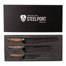 Steelport Knife Co. Signature Knife & Board Set, featuring three handcrafted knives with wooden handles and black blades, arranged neatly in a foam insert beneath the branded Steelport Knife Co. lid.