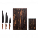 The Steelport Knife Co. Signature Knife & Board Set by Steelport Knife Co. features three handcrafted knives with patterned wooden handles and black blades, displayed alongside two end-grain walnut cutting boards to create a stunning addition to your kitchen.