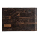 A compact, rectangular dark walnut cutting board featuring a distinctive end-grain patchwork design and the Steelport Knife Co. name engraved along the right edge. The Steelport Knife Co. SteelCore™ 2-in-1 Walnut Cutting Board (9"x6") is perfect for kitchens with limited counter space or as a stylish mini board for quick prep work.