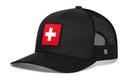 Introducing the Haka Hat Swiss Flag Trucker Hat | Switzerland Snapback by Haka Hat—a sleek black trucker hat featuring breathable mesh sides and a prominent red patch with a white cross on the front, evoking the Swiss flag. This stylish hat includes an adjustable snapback closure to ensure the perfect fit.