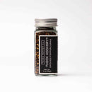 A clear glass jar with a metal lid contains Texas Salt Co. Thick Hickory Smoked Peppercorn, a bold hickory smoked seasoning. The black label shows Texas Salt Co. Thick Hickory Smoked Peppercorn, net weight 2 oz (56g), on a white background.