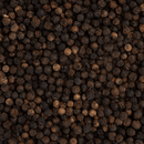 A close-up of Texas Salt Co. Tellicherry Peppercorns by Texas Salt Co. reveals their rough texture and rich shades of dark brown and black.