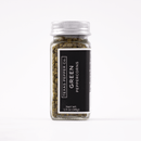 A clear glass jar with a silver lid, filled with whole green peppercorns. The black label reads Texas Salt Co. Green Peppercorn and lists the net weight as 1.5 oz (43g). Enjoy their fresh citrus aroma in your favorite dishes.