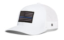 Haka Hat Thin Blue Line Trucker Hat, a white trucker hat with a black Thin Blue Line American flag patch featuring a single horizontal blue stripe.