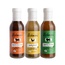 The Hickman's BBQ Marinade Package from Hickman's BBQ features three bottles of injectable marinades—in Bovine Bonanza (beef), Party Fowl (poultry), and Divine Swine (pork)—each with vibrant orange, yellow, and green labels, respectively. Designed for barbecue injectors, this versatile set is showcased on a clean white background.