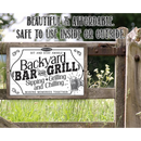 A rustic wooden fence displays Lone Star Art's Backyard Bar & Grill - Metal Sign, featuring the phrase: "Sipping, Grilling and Chilling. Making Memories Together." This stylish and affordable sign is ideal for indoor or outdoor barbecue decor.