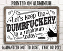 The Let’s Keep The Dumbfuckery - Metal Sign by Lone Star Art features a thumbs-up graphic and bold message—perfect for adding durable, irreverent flair to your office decor.