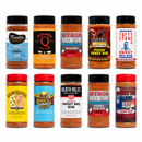 Ten bottles from the DDR BBQ Supply "Top 10 Store-Bought BBQ Rib Rubs Variety Pack" are arranged in two rows on a white background, each with vibrant labels—a great assortment for trying different BBQ rib rub flavors.