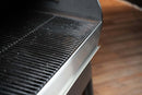 Pimp My Grill® Bodyguard Stainless Steel Grease & Paint Protector installed on the side of a grill grate as a drip edge guard.