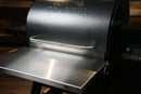 Pimp My Grill® Bodyguard Stainless Steel Grease & Paint Protector attached to the front of a black pellet grill.