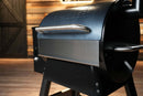 Pimp My Grill® Bodyguard Stainless Steel Grease & Paint Protector attached to the front of a pellet grill to act as a shield.