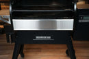 Pimp My Grill® Bodyguard Stainless Steel Grease & Paint Protector installed on the front panel of a black Ironwood 885 pellet grill.