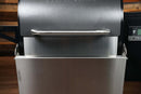 Pimp My Grill® Bodyguard Stainless Steel Grease & Paint Protector attached to the front of a pellet grill to act as a shield.
