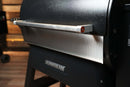 Pimp My Grill® Bodyguard Stainless Steel Grease & Paint Protector for Ridgeline XL, shown attached to the front of the black lid below the handle.