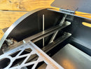 Two metal slide-out racks installed inside a grill chamber as part of a Pimp My Grill® Pro Series Slide-Out Rack System for the Traeger Tailgater / Junior.