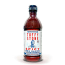 Tuffy Stone Spicy BBQ Sauce bottle with smoky heat, perfect for grilling ribs, brisket, and wings