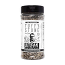 Tuffy Stone Steak Night Prime Seasoning bottle next to grilled steak with savory crust and bold BBQ flavor