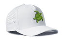 The Haka Hat Turtle Performance 5-Panel Hat by Haka Hat is a white Flexfit snapback cap featuring a green cartoon turtle embroidered on the front. Designed with side ventilation holes, a curved brim, and a comfortable Flexfit sweatband, it offers all-day comfort and style.