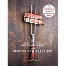 A meat fork holds two slices of seared grass-fed beef against a wooden background on the cover of the cookbook Pure Beef: An Essential Guide to Artisan Meat with Recipes for Every Cut - Hardcover.