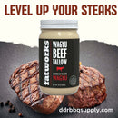 Rendered American Wagyu beef tallow in glass jar with smooth texture, ideal for grilling and smoking