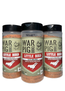 Three containers of WarPig BBQ Little Bird BBQ Rub, each with a red and green label featuring a pig logo and the outline of Texas, are displayed against a white background. This versatile seasoning from WarPig BBQ is perfect for chicken or poultry at your next backyard cookout.