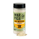A container of WarPig BBQ Sgt. Butter BBQ Rub, an all-purpose seasoning crafted with real butter, is displayed next to a small pile of the rub. The label emphasizes its savory blend of salt, pepper, garlic, and buttery flavors.