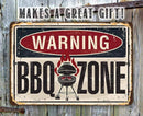 Vintage-style sign with 'Warning BBQ Zone' text on a rustic wooden background.