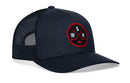 Dark blue Haka Hat Washington DC Hockey Trucker Hat | WSH X snapback with a circular patch featuring two crossed hockey sticks, a puck, and the letters W, S, and H.