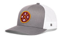 The Haka Hat Washington DC Trucker Hat is a black snapback with a mesh back, featuring a round maroon patch displaying yellow WAS letters and a football icon crossed on the front—a classic DC trucker style from Haka Hat.