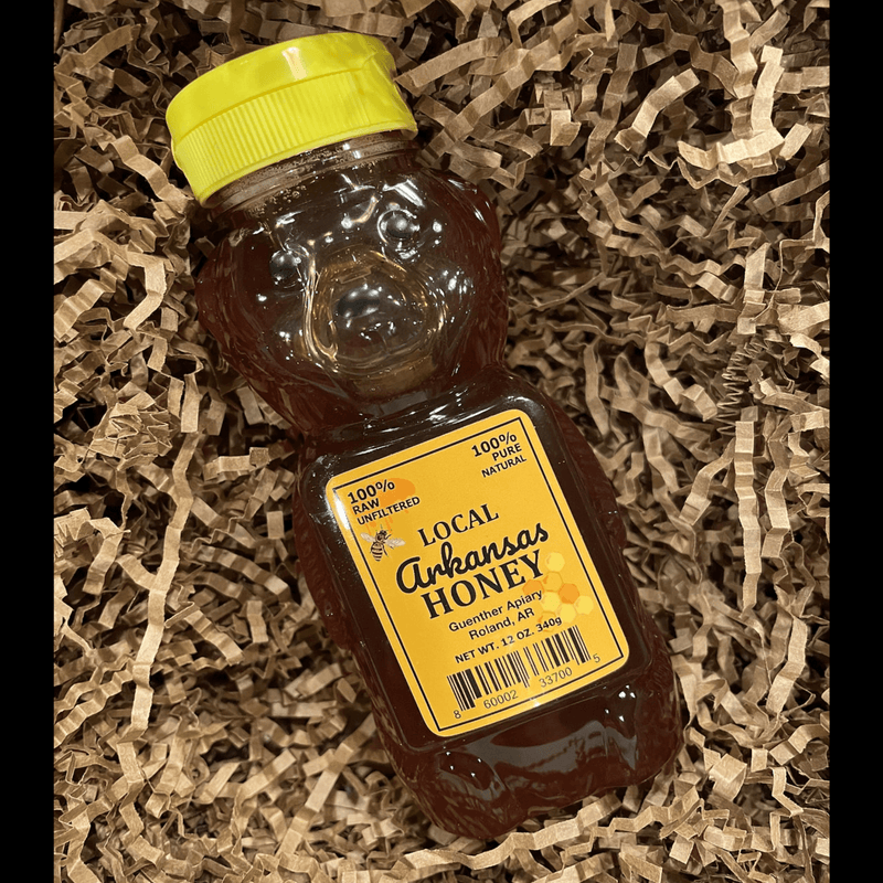 Raw Arkansas wildflower honey in a bear bottle—pure, unfiltered, and locally harvested in Arkansas