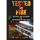 Paperback cover for Tested by Fire: Recipes for Leaders, with Metaphors on the Grill by Karl D. Klicker, featuring a stainless steel gas grill used as a metaphor for leadership development.