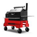 The Yoder Smokers YS640S Competition Pellet Grill with stainless steel shelves features a black and red rectangular body, chimney, and sturdy wheels for mobility, shown against a white background.