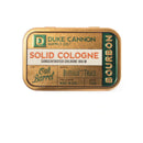 Duke Cannon Bourbon Solid Cologne tin with oak barrel-inspired scent at DDR BBQ Supply