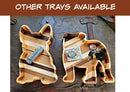 The French Bulldog Wood Tray by Two Acre Woodworks holds money, keys, and coins. Handcrafted for dog lovers, this decorative organizer rests on a rustic metal surface. “OTHER TRAYS AVAILABLE” appears above.