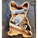The French Bulldog Wood Tray by Two Acre Woodworks holds a multi-tool, $100 bill with coins, and keys with keychains on textured metal and leather—a perfect handcrafted organizer and unique gift for dog lovers.
