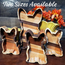 Two Acre Woodworks’ French Bulldog Wood Tray is displayed with three other dog-shaped wooden trays in two sizes before orange flowers in yellow vases. A handcrafted decorative organizer and perfect dog lover gift. Two Sizes Available appears at the top.