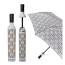 The Savanna Bottle Umbrella by Vinrella is a compact umbrella with a geometric leaf pattern, shown beside its closed case, which resembles a bottle and features matching designs along with the Vinrella brand name on the side.
