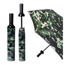 The Vinrella Camo Wine Bottle Umbrella features a green camouflage pattern and fits in a wine bottle-shaped case. Its no-drip design keeps things mess-free, shown closed in the case and open to reveal its bold camo style.