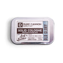 Duke Cannon Old Glory Solid Cologne tin with tobacco, leather, and amber scent at DDR BBQ Supply