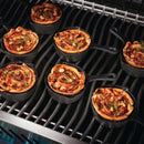 Napoleon Cast Iron Dessert Cooker shown on grill with food in it. 